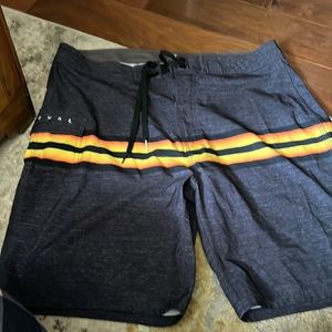 Mens 26” Rip Curl board shorts with draw string front and back pocket.